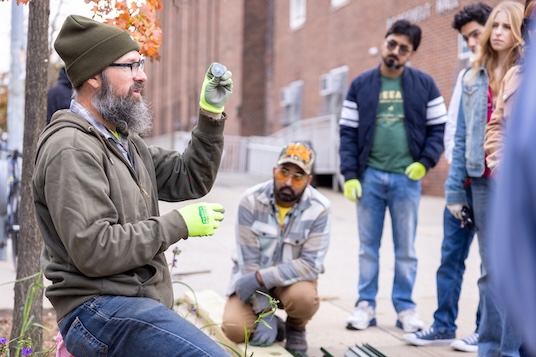 (Left to right) Gil Lopez, Co-Director of Compost Education & Application at Big Reuse; Stalin Haeger-Espinal ’18 Sustainability Coordinator at Brooklyn College, Idrees Ilahi '24, Deputy Director at TREEage, led a youth-led climate justice group to install four tree guards along Bedford Avenue in October. The installation involved 40 volunteers and was coordinated by Haeger-Espinal along with Ilahi. Tree guards help protect young trees, which naturally help to combat urban heat.