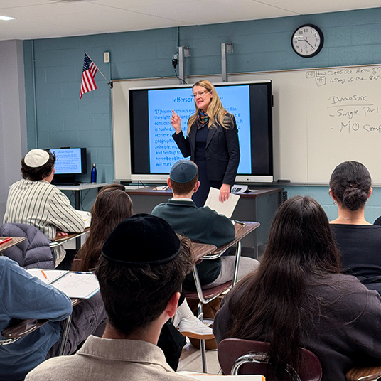 President Michelle J. Anderson addresses students at Yeshivah of Flatbush Joel Braverman High School.