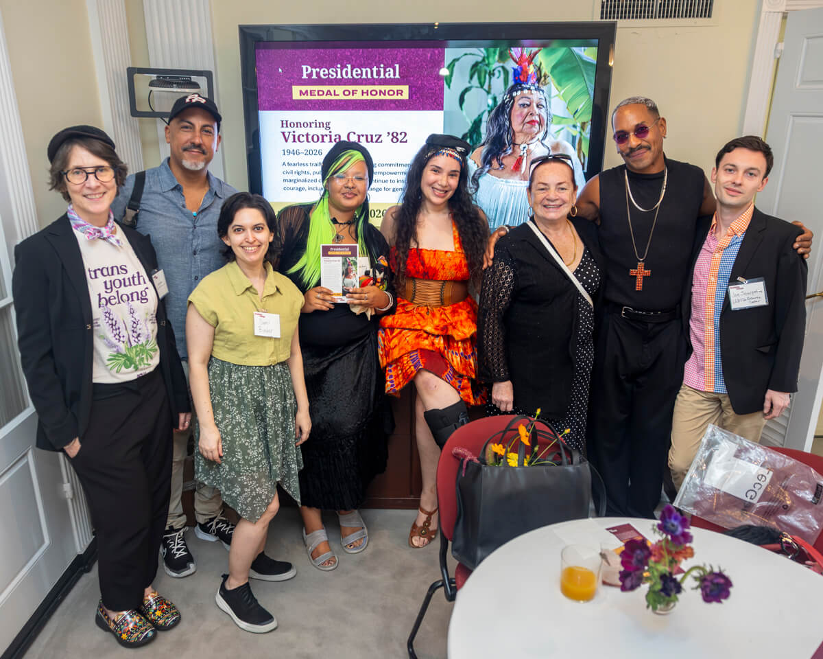 Attendees of the Presidential Medal of Honor ceremony gather with Victoria Cruz’s sister, Heydey Cruz (third from right), to honor the pioneering activist’s life and legacy.