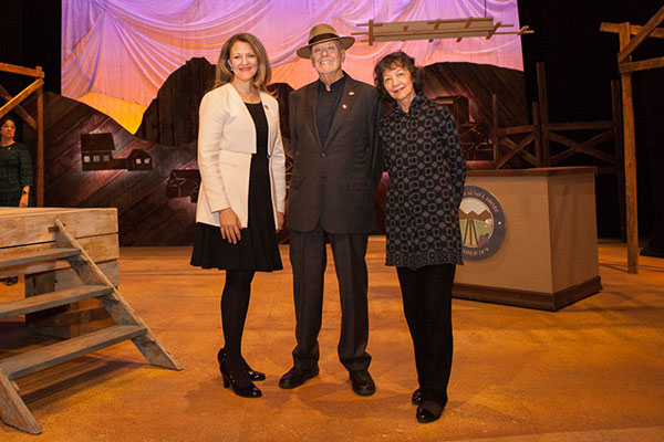 Michelle J. Anderson with Don Buchwald and his wife, Maggie, on the stage of the Don Buchwald Theater at Brooklyn College.