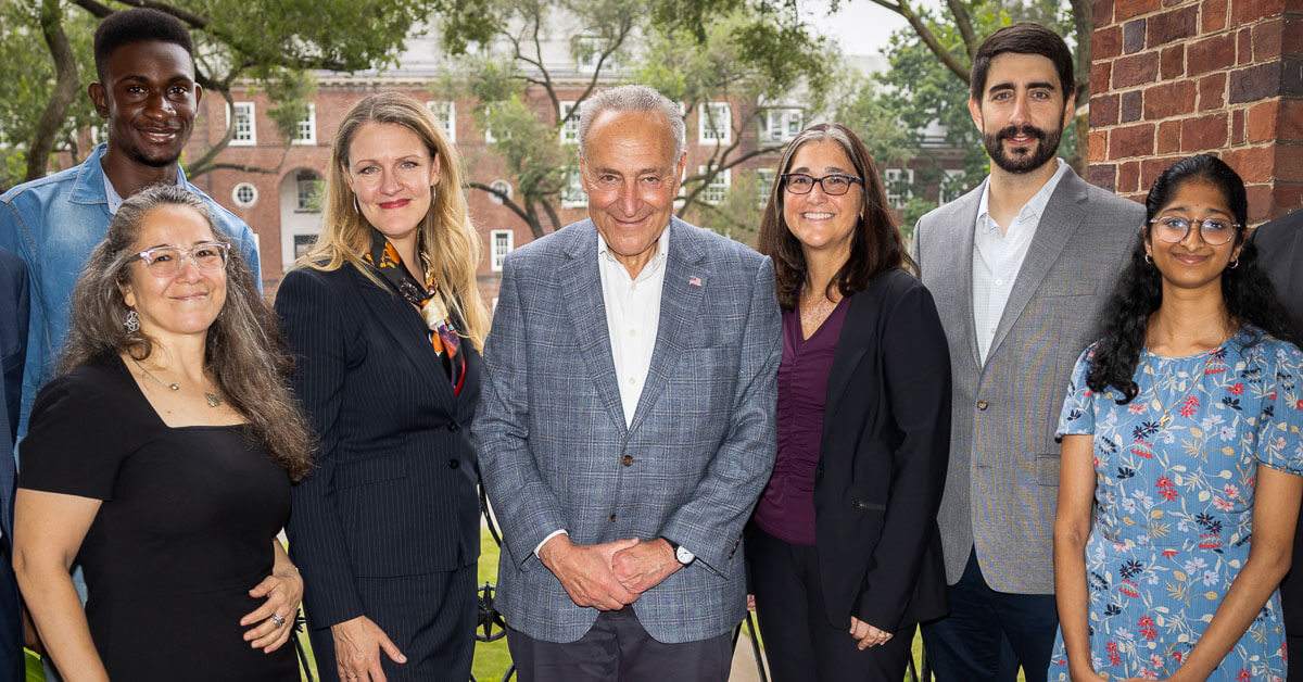 On September 8, 2023, Senate Majority Leader Charles E. Schumer (center) and Brooklyn College President Michelle J. Anderson (third from left) met and discussed some of the college’s programs, including the Tow Mentorship Initiative and Brooklyn College Cancer Center (BCCC-CURE).