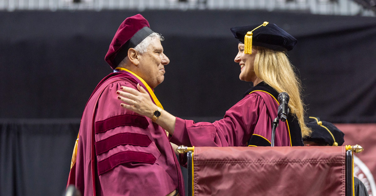 Brooklyn College President Michelle J. Anderson awards Evan Silverstein, ‘76, Brooklyn College Foundation Board of Trustees Chair, with the Presidential Medal of Honor.