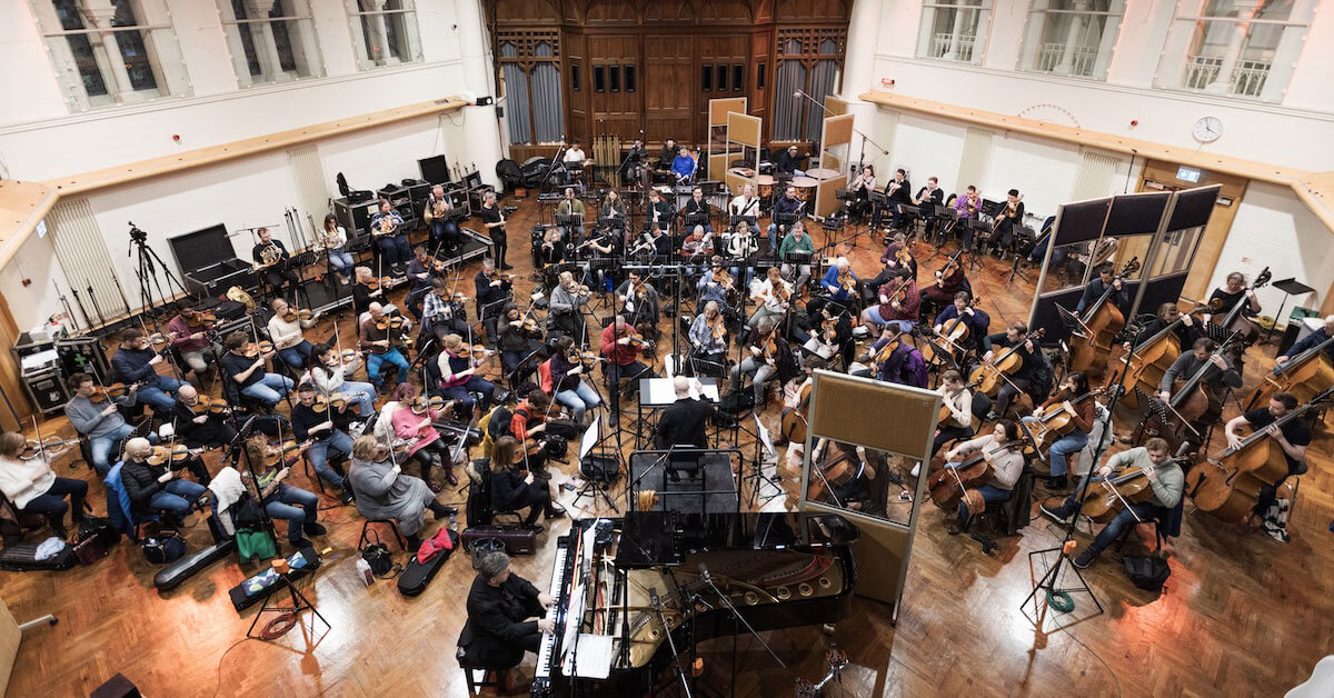 Brooklyn College associate professor and internationally renowned composer Jeffrey Biegel (on piano) performs "Rhapsody in Red, White & Blue" with the London Symphony Orchestra in 2023.