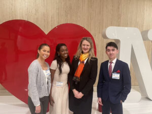 (Left to Right) Brooklyn College students Ivona Kulusic-Ho, Samantha Lee, and Damir Shavkatov attend the Somos Conference with President Michelle J. Anderson.