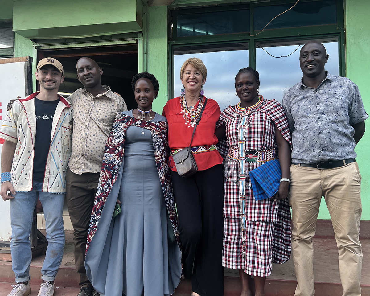 Joyce Tannian ’00, third from right with Water for Life Kenya cofounder Joseph Larasha, at right