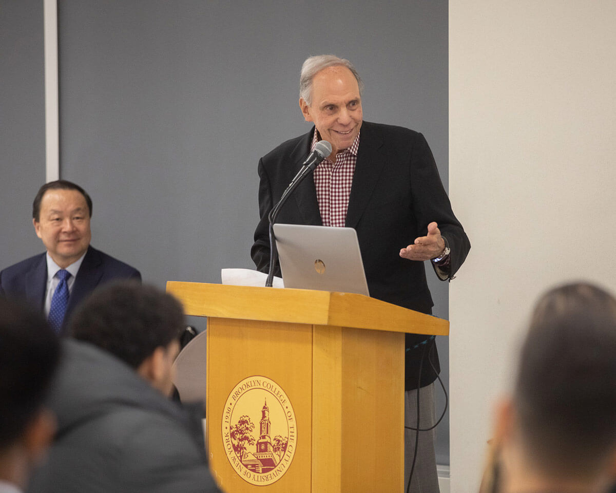 Martin D. Sass delivers remarks at a podium.